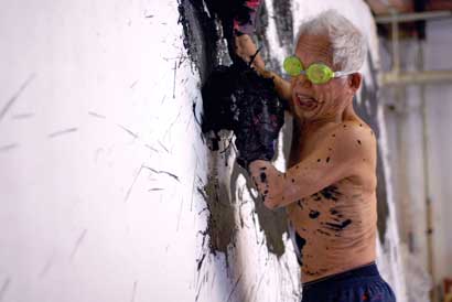 CUTIE_Ushio_Shinohara_boxing_painting Ushio Shinohara working on a boxing painting. From Zachary Heinzerling’s CUTIE AND THE BOXER, a documentary about the 40-year marriage of artists Ushio and Noriko Shinohara. Photo credit: Patrick Burns